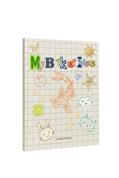 A notebook titled 'My Book of Ideas' by Ivorie Books, featuring a beige grid paper cover decorated with colorful doodles of a rabbit, fish, stars, and smiley faces, shown at a three-quarter angle on a white background.