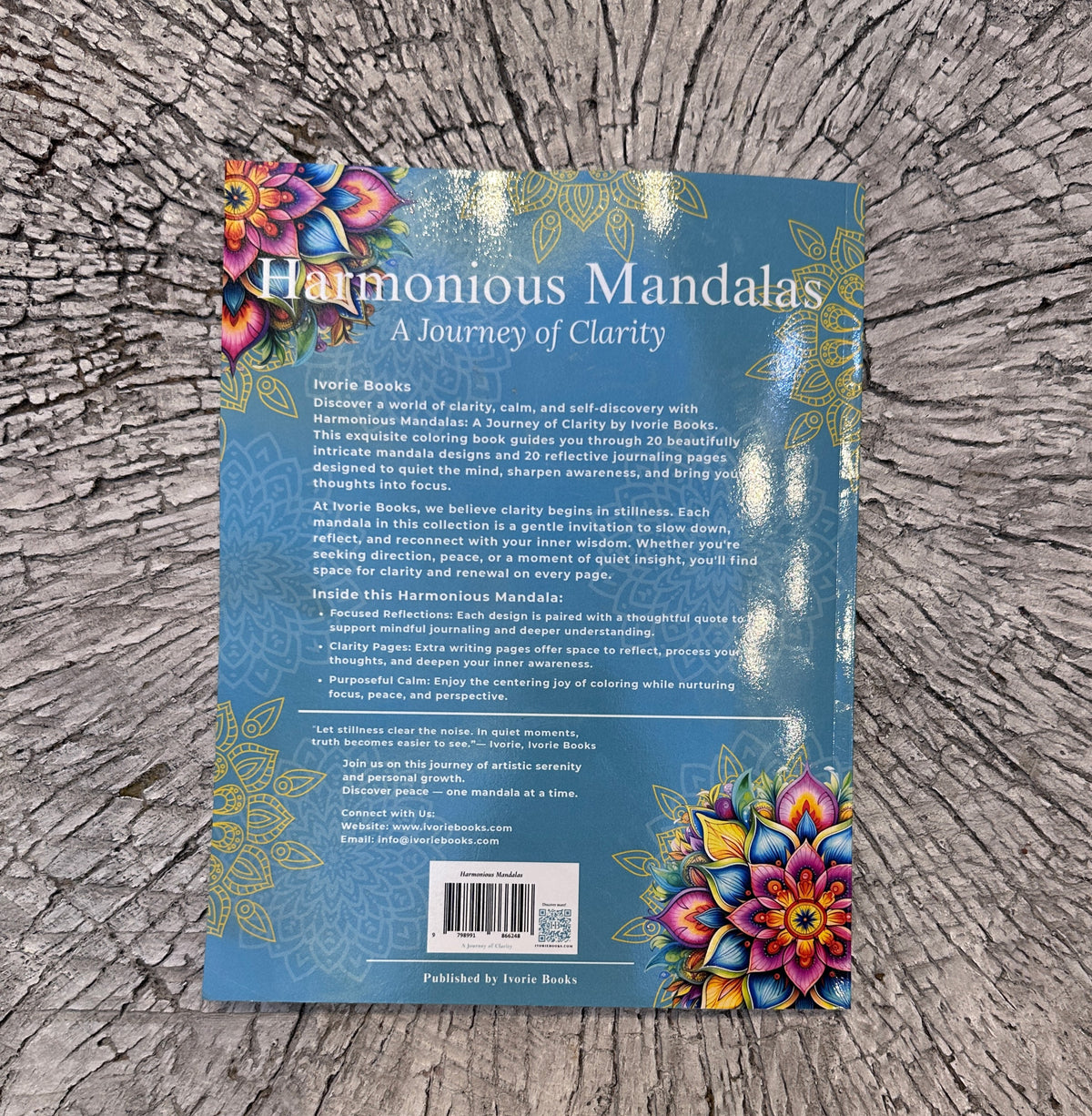 Paperback detail view of Harmonious Mandalas A Journey of Clarity coloring book. 
Paperback detail view of Harmonious Mandalas: A Journey of Clarity, showing the printed cover design and physical book quality.